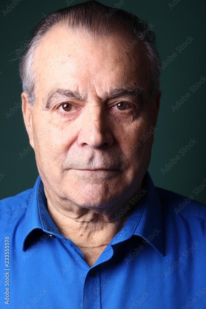 Beautiful older man in front of a colored background Beautiful older man in front of a colored background