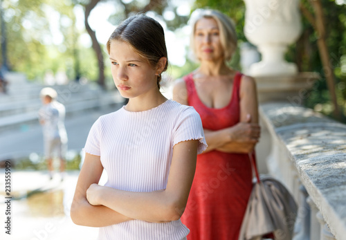 Dissatisfied girl and woman outside
