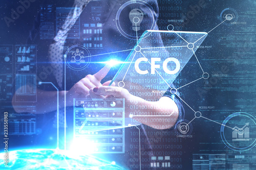 The concept of business, technology, the Internet and the network. A young entrepreneur working on a virtual screen of the future and sees the inscription: CFO