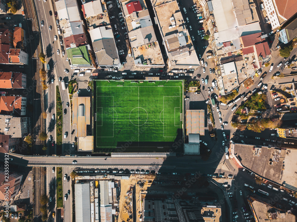 aerial view of a football field in residental area. top view of football pitch - obrazy, fototapety, plakaty 