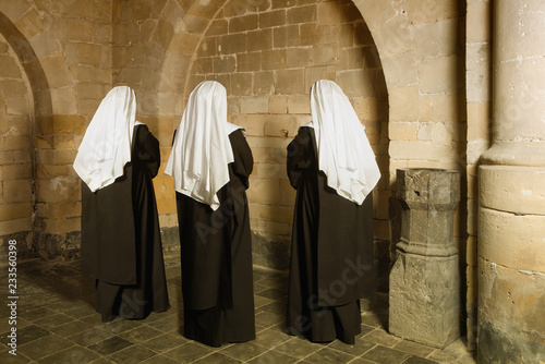 Nuns in medieval convent photo