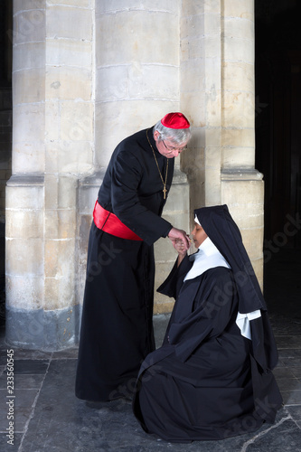 Nun kissing ring cardinal photo