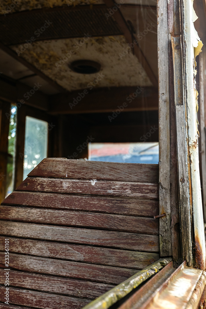 Wooden chair in old rusty destroyed tram. Wooden chair in old rusty destroyed tram.