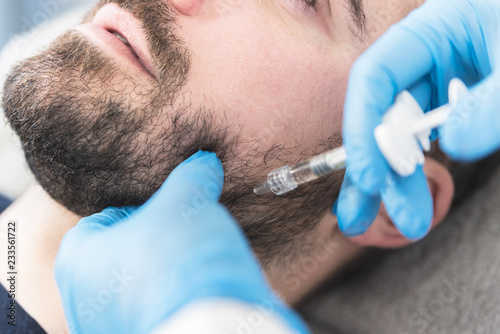 Man doing fillers on jaw photo