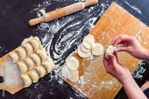 Making dumplings with stuffing at cooking master-class photo