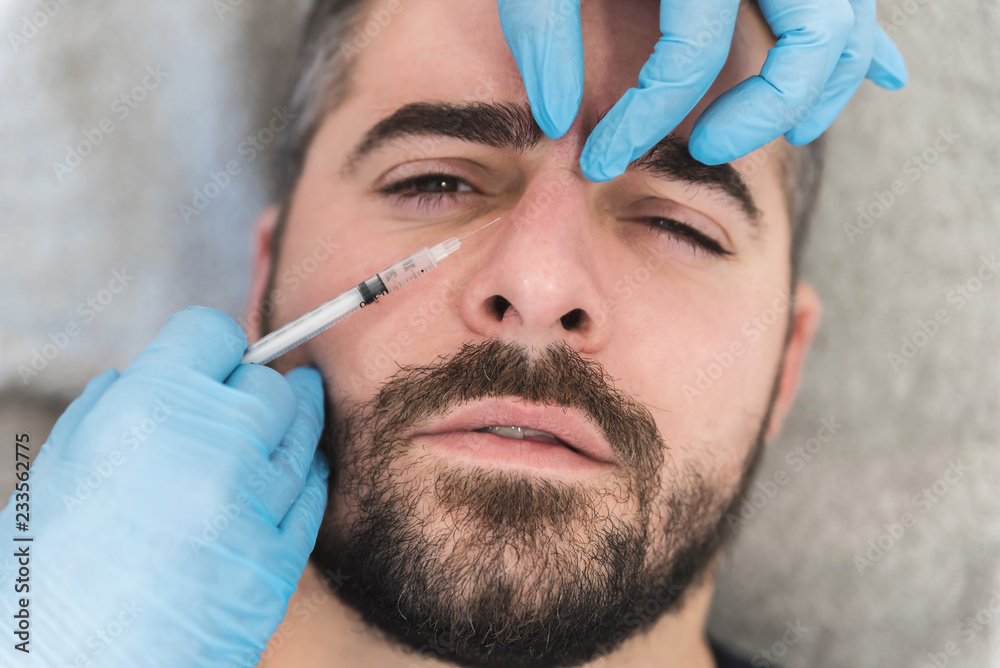 Nose fillers done on man at clinic Nose fillers done on man at clinic