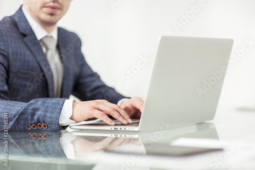 successful businessman working on laptop in the workplace.