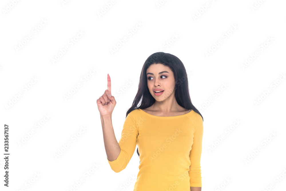 young african american woman pointing up with finger and looking away isolated on white young african american woman pointing up with finger and looking away isolated on white