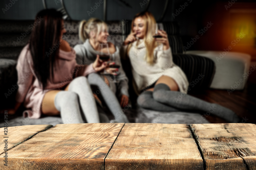 Table background of free space and christmas time. Three girls in home 