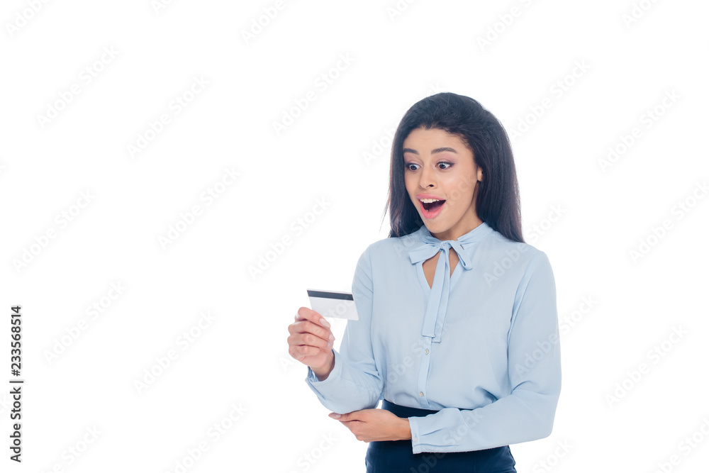 surprised young african american woman holding credit card isolated on white surprised young african american woman holding credit card isolated on white