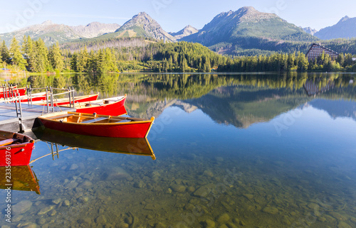 wooden boats on lake water surface