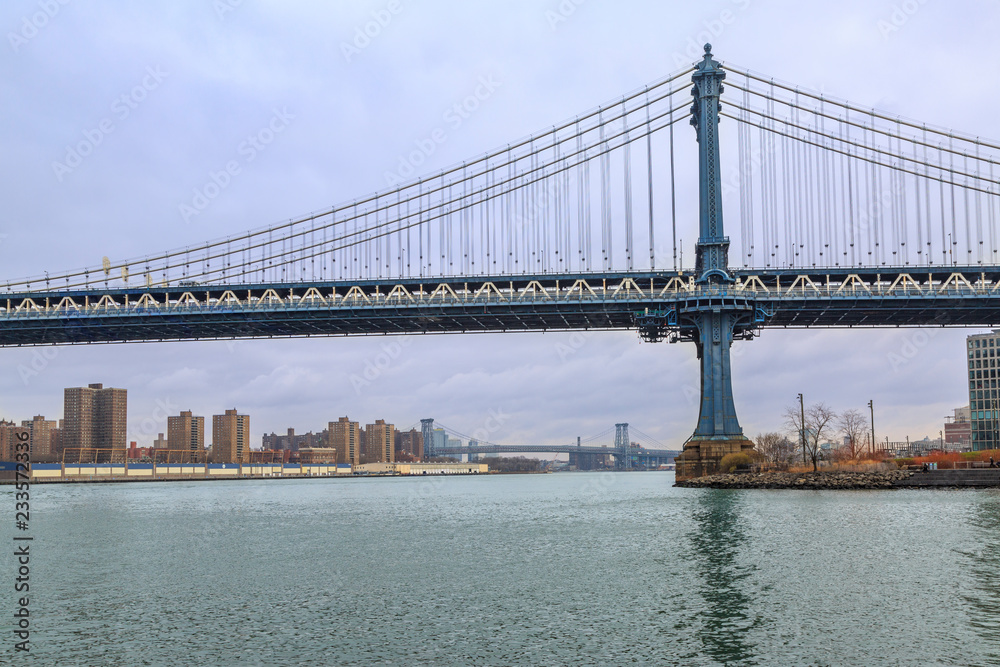 Manhattan bridge from side and Williamsburg bridge on distance from Brooklyn, New York, USA