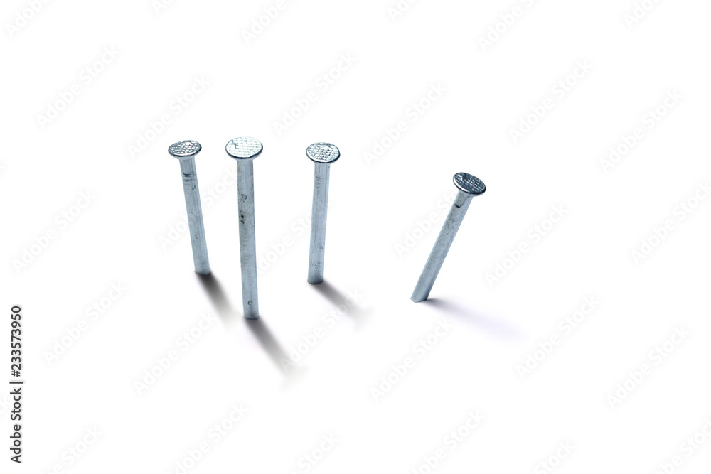 group of nails pegged on white background isolated group of nails pegged on white background isolated