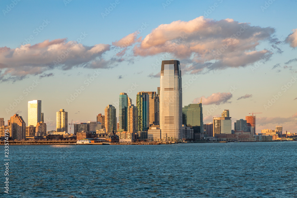 Jersey City from Hudson river during sunset in Jersey City, NJ, USA