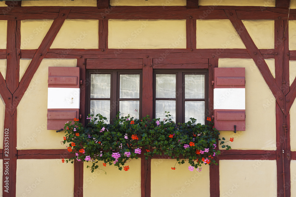 Part of house wall with window in traditional German fachwerk (timber