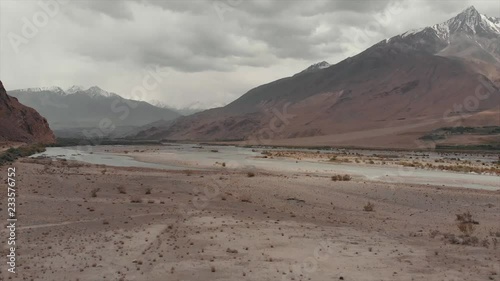 Areal Dron Shoot View of the Pamir, Afghanistan and Panj River Along the Wakhan Corridor. The Afghanistan-tajikistan Border. M41 Pamir Highway.