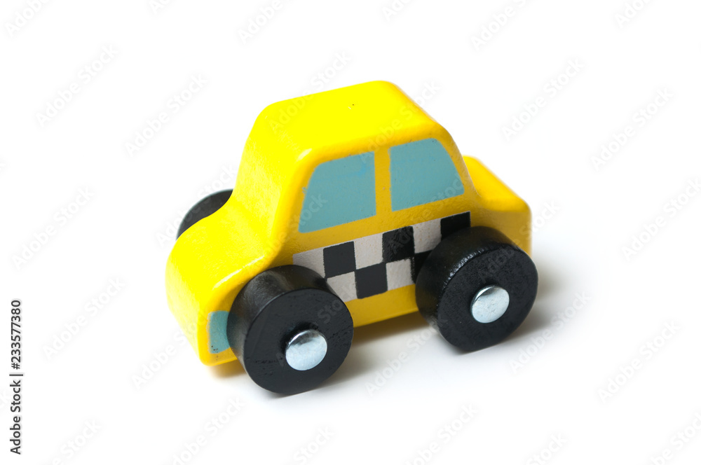 closeup of miniature wooden car on white background - concept taxi closeup of miniature wooden car on white background - concept taxi
