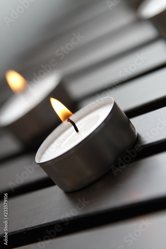 Tea lights on a wooden bench