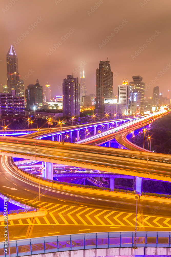 Fototapeta premium Traffic tracks in the downtown area of Shanghai at night