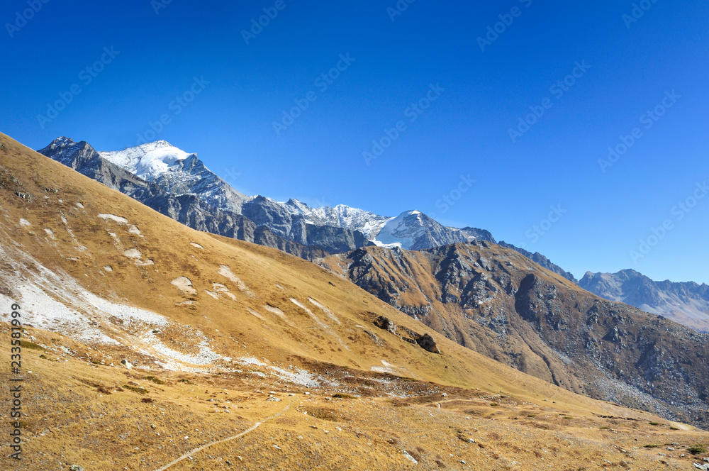 beautiful mountain landscape with view on a glacier under blue sky 
