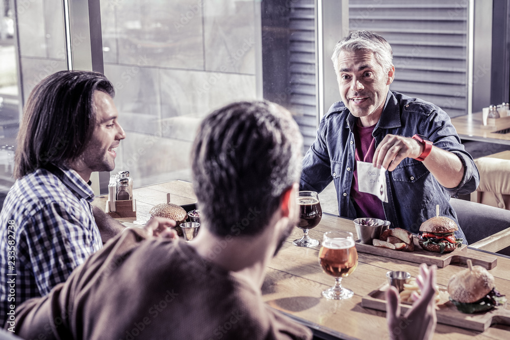 Obraz premium Handsome three males visiting teambuilding meetings together