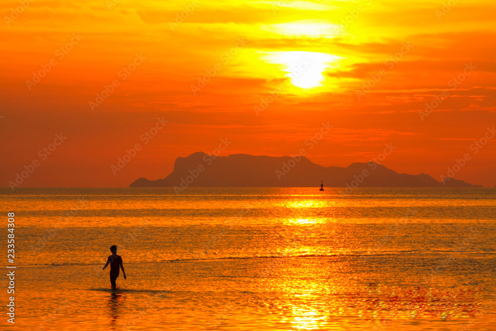 silhouette of fisherman at sunset