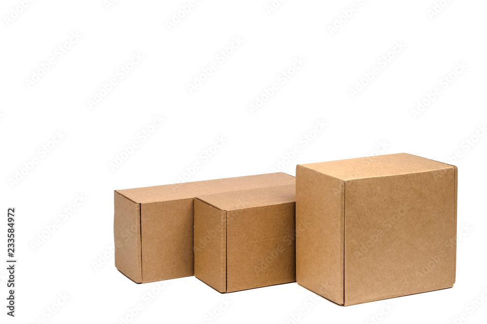 Fototapeta premium Cardboard boxes for goods on a white background. Different size. Isolated on white background.