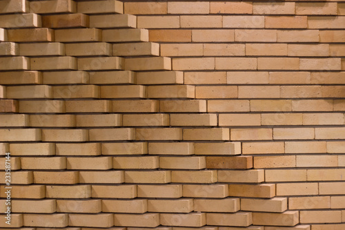 Diagonal and horizontal brick tile wall texture background.