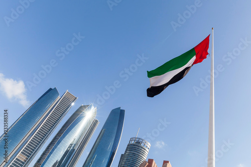 UAE flag waving in the sky, national symbol of UAE