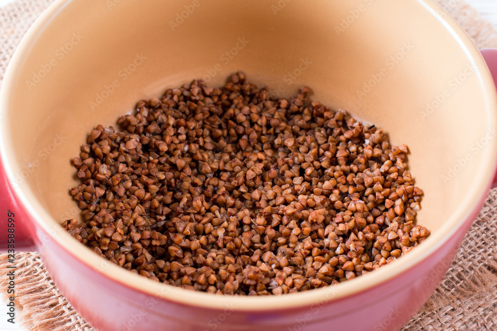 Buckwheat grain in the saucepan Buckwheat grain in the saucepan