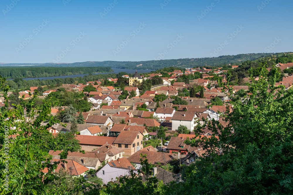 Sremski Karlovci, Serbia - May 2, 2018: Panorama of Sremski Karlovci. Panoramic view of the roofs of the house, Chappel of Peace and Danube river.