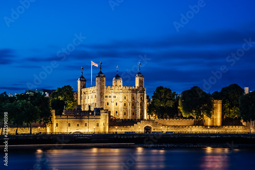 Night view of the Tower of London, England across Thames River