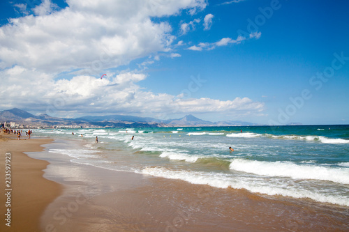 View over the sunny coast line of San Juan, El Campello and Villajoyosa at the Costa Blanca Spain.  photo