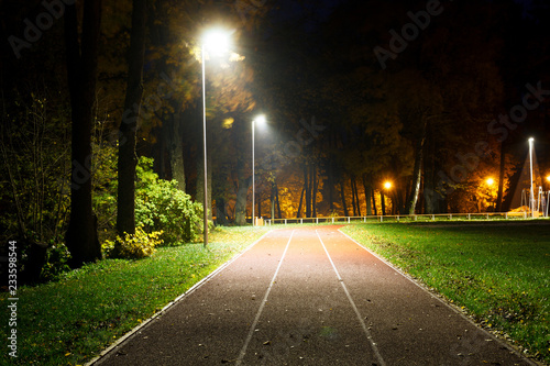 empty running track in small countryside stadium