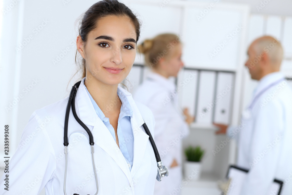 Portrait of young doctor woman in hospital. Hispanic or latin american staff in medicine Portrait of young doctor woman in hospital. Hispanic or latin american staff in medicine