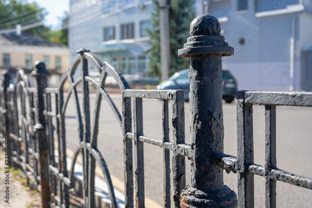 Old wrought iron fence with cracked paint Old wrought iron fence with cracked paint