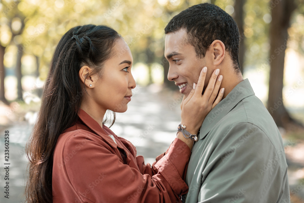 Charming international girl looking into male eyes Charming international girl looking into male eyes