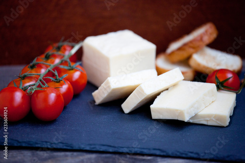 Halloumi squeaky cheese on a slate plate photo