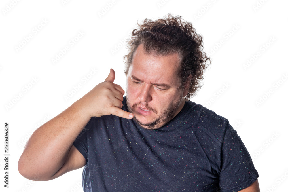 Fat handsome guy showing call me sign. Man in casual keeping hand at ear and imitating phone talk. Gesturing or telephone concept Fat handsome guy showing call me sign. Man in casual keeping hand at ear and imitating phone talk. Gesturing or telephone concept
