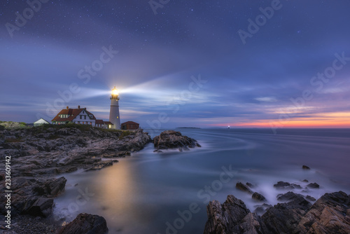 Night to day image of Portland Head Lighthouse at Cape Elizabeth, Maine  photo