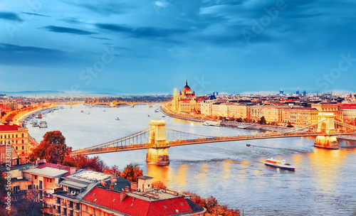 The creative processed landscape photography of Budapest city, view on Chain Bridge and Parliament Building over Danube river delta - the Golden Town beneath the Blue Sky - concept of Dream city.