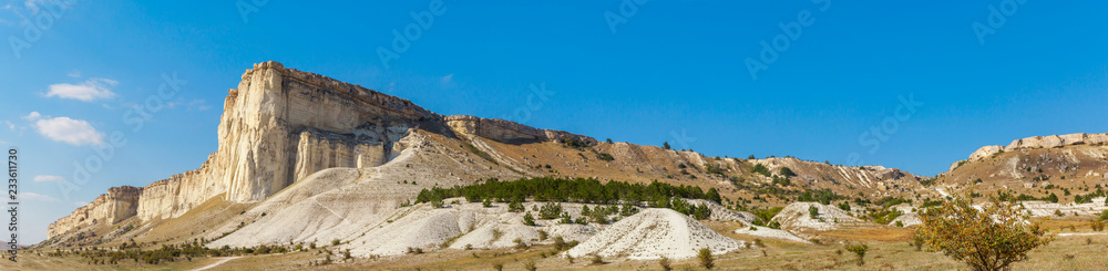 View of White rock or Aq Qaya on a Sunny summer day. Crimea. White limestone with a vertical cliff View of White rock or Aq Qaya on a Sunny summer day. Crimea. White limestone with a vertical cliff