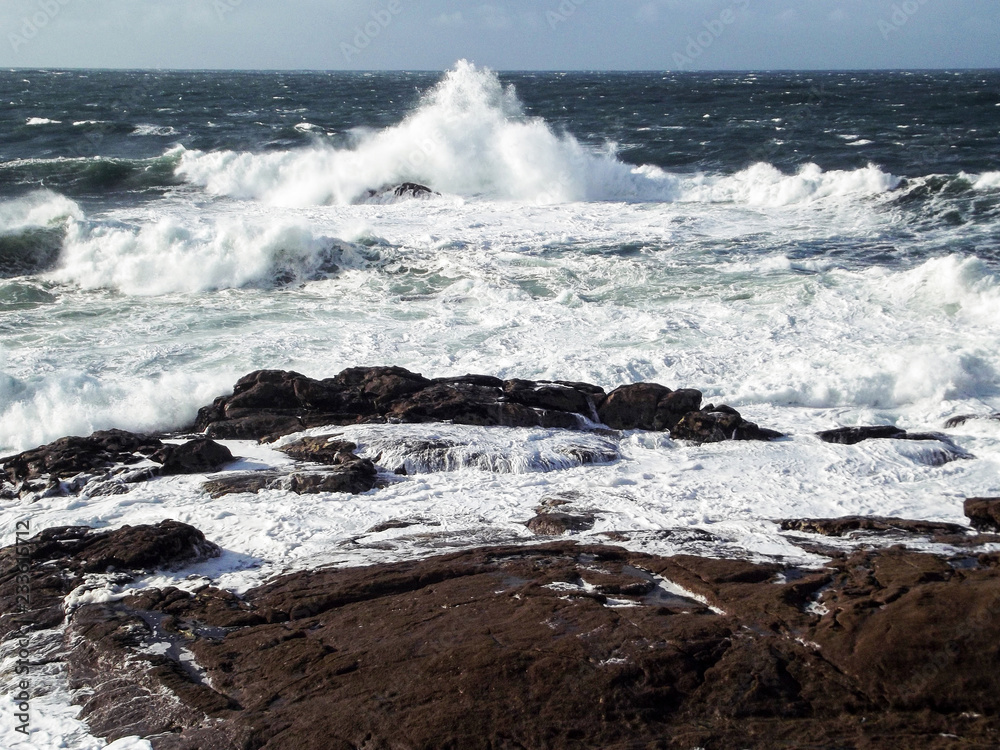 waves crashing against the rocks of the coast, atlantic sea