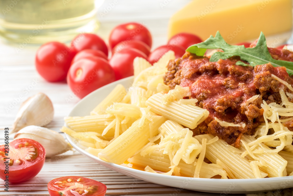 Italian pasta bolognese from pasta penne rigatone minced meat in tomato sauce and parmesan cheese Italian pasta bolognese from pasta penne rigatone minced meat in tomato sauce and parmesan cheese