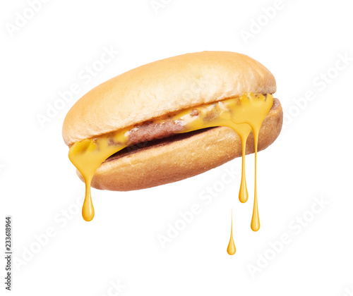 Melted cheese flows from cheeseburger on white background photo