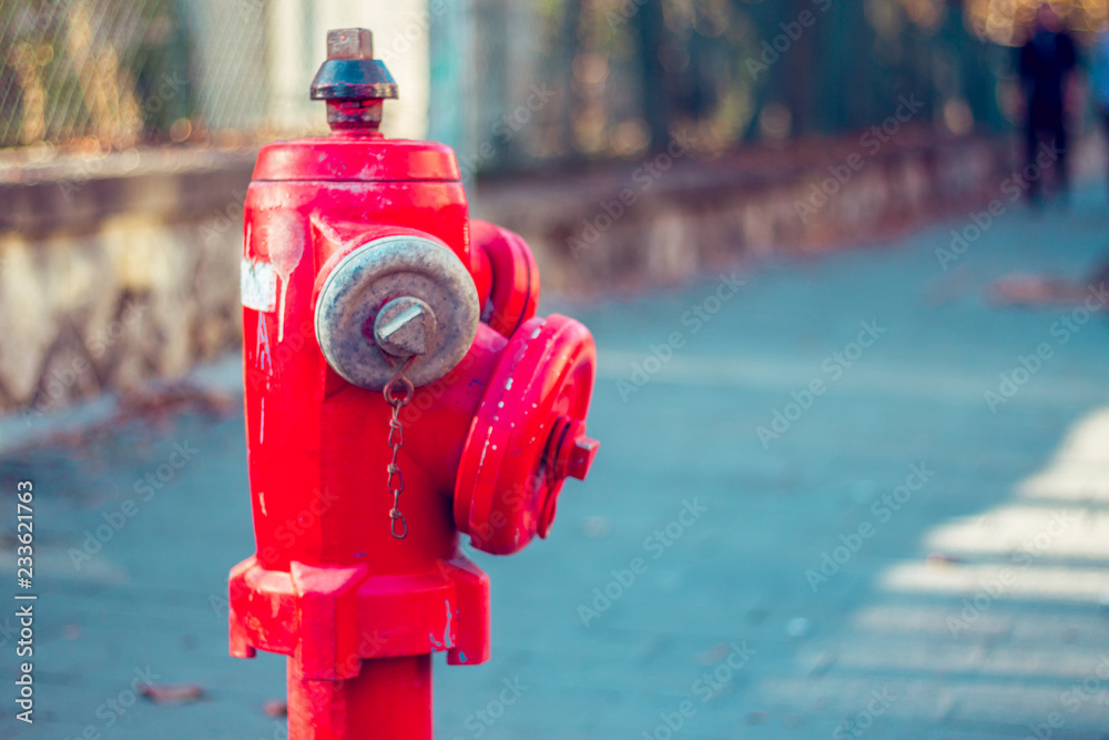 Closeup side view of a city red hydrant to be used on emergencies. Closeup side view of a city red hydrant to be used on emergencies.