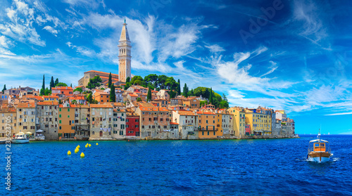 Wonderful romantic old town at Adriatic sea. Boats and yachts in harbor at magical summer. Rovinj. Istria. Croatia. Europe. photo