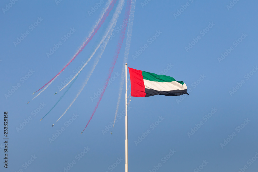 Aerobatic team flying over UAE flag in Abu Dhabi. National day celebration.