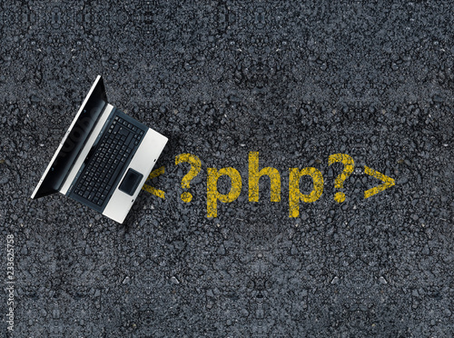 php programming language. Laptop on php tag drawn with paint on road asphalt photo