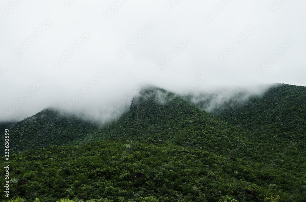 Group of mountains surrounded by haze